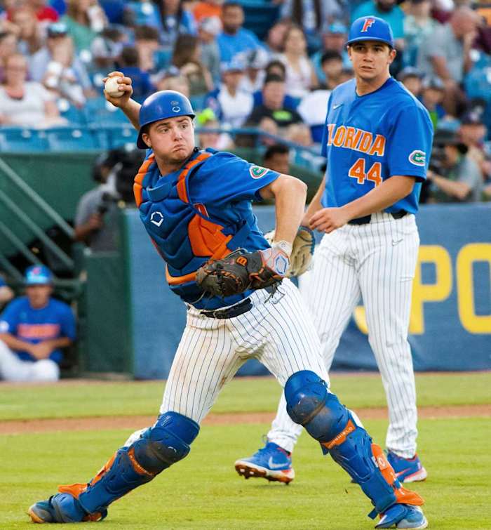 May 28, 2022; Hoover, AL, USA; Florida catcher Mac Guscette (9) fields a bunt and throws to first to retire a Texas A&M batter in the SEC Tournament at the Hoover Met in Hoover, Ala., Saturday. Mandatory Credit: Gary Cosby Jr.-The Tuscaloosa News Sports Sec Baseball Tournament Texas A M Vs Florida